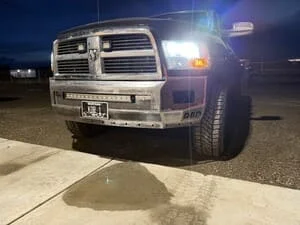 Custom steel front bumper with grille guard on pickup truck, welded steel construction with LED mounts
