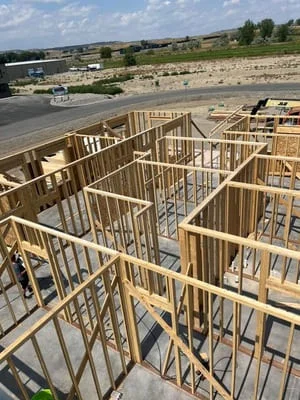 Steel frame structure with welded columns and studs on concrete foundation during residential construction